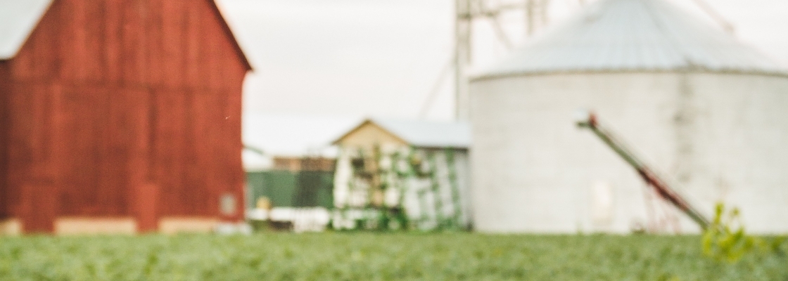 a red barn and a silo