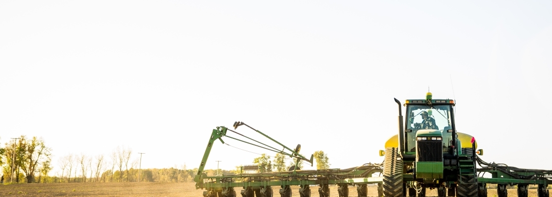 a tractor plowing the fields